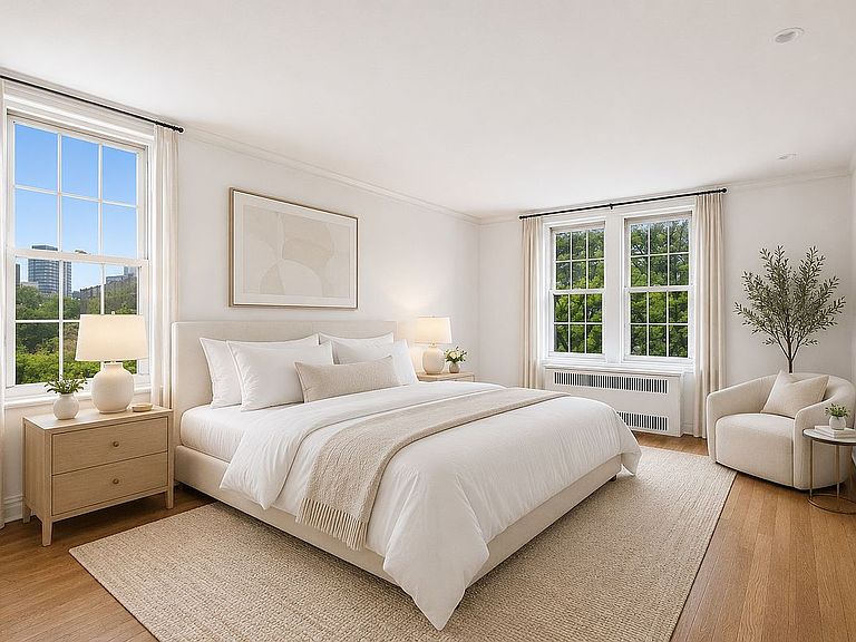 The primary bedroom of 360 Clinton 3T, a soundproofed retreat with a California King, two banks of windows on two exposures, and a chair tucked into the corner